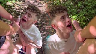 Tombakerx & Britboysxxx get their little twink boys to suck on a big juicy veiny cock in the woods