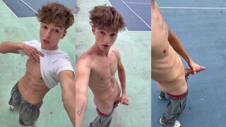 A cute boy masturbates his big cock on the tennis court in this hot gay video